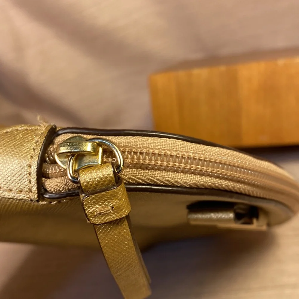 Coach gold metallic color cosmetic pouch w/elegant bow